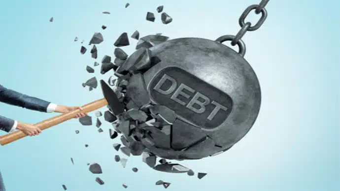 Recking ball with word debt being hit by a sledgehammer. It signifies the decision debt