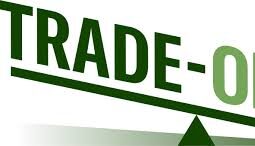 a simple balancing scale with the words trade offs written across