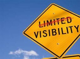 Yellow Diamond sign with the words Limited Visibility. The word Limited is crossed out with a red line.