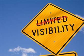 Yellow Diamond sign with the words Limited Visibility. The word Limited is crossed out with a red line.
